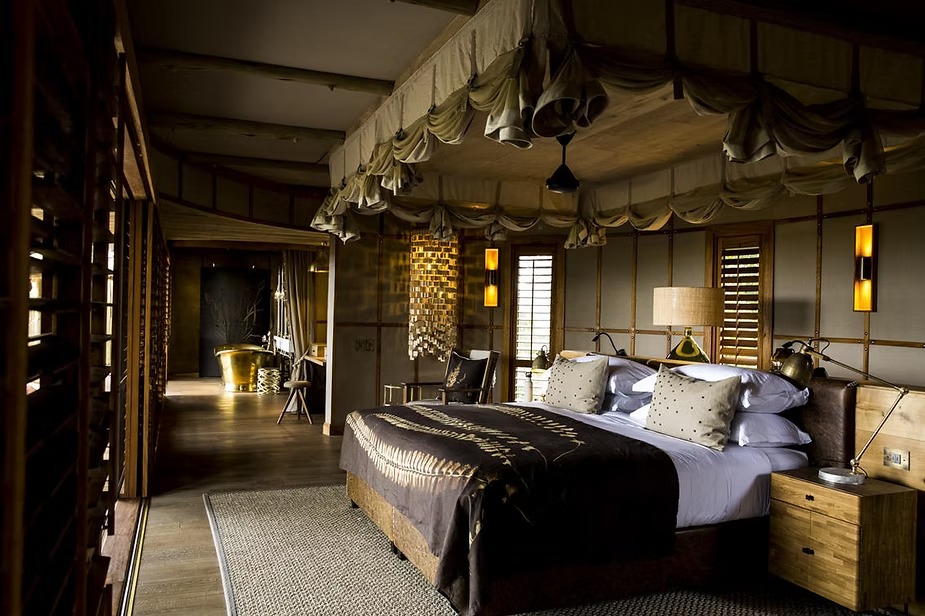 The bedroom of a suite at Little Mombo in the Okavango Delta