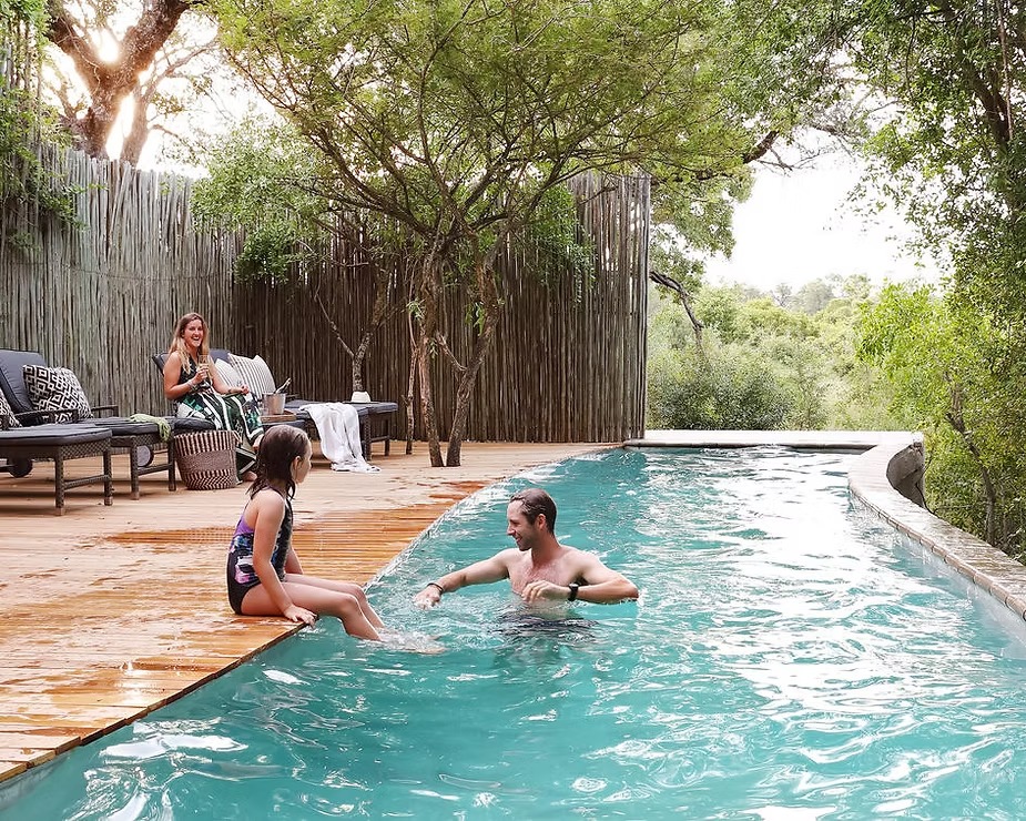 A family in the private pool at Londolozi Pioneer Camp