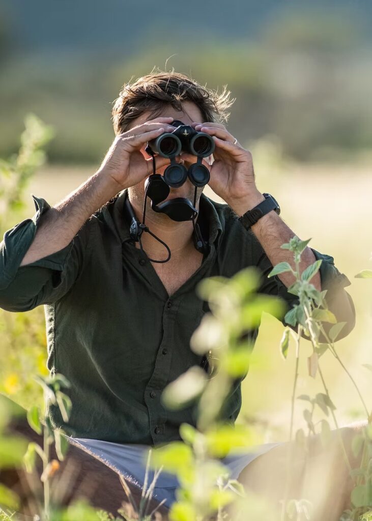 Glassing the bush through a pair of Swarovski binoculars