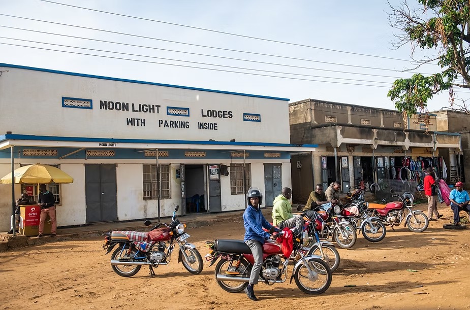 A roadside town on the way to the gorilla parks, motorbike taxis waiting for fares