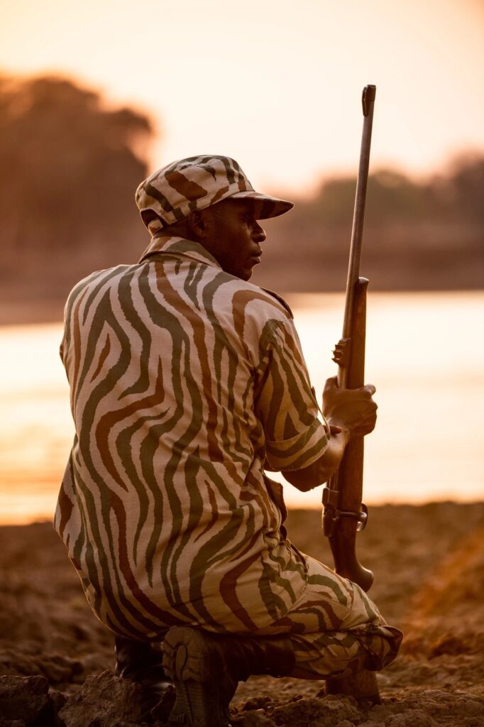 A national park scout on watch at first light